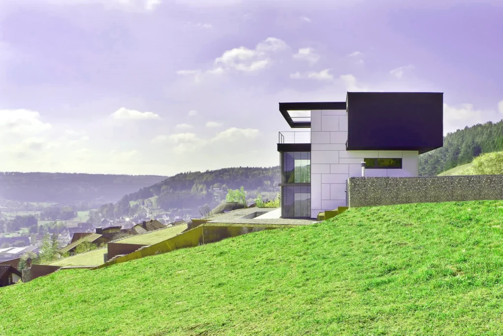 building a house on a sloped lot challenges and solutions