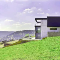 building a house on a sloped lot challenges and solutions